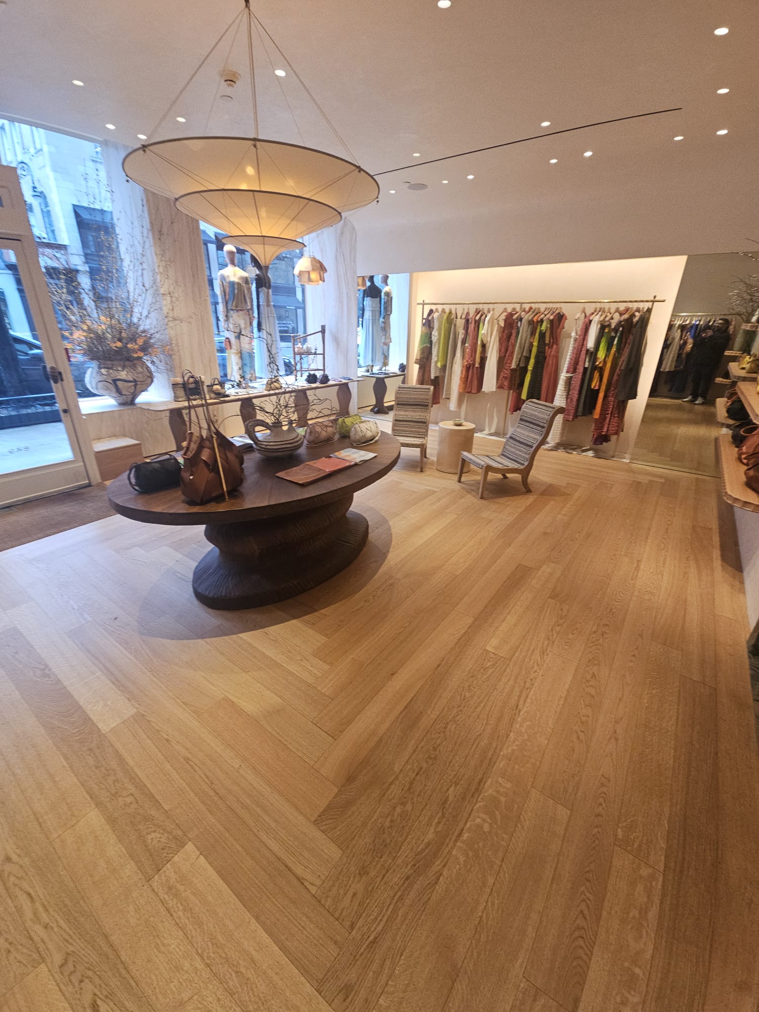 Custom pattern engineered oak floor across the sales floor of the Ulla Johnson boutique on Madison Avenue