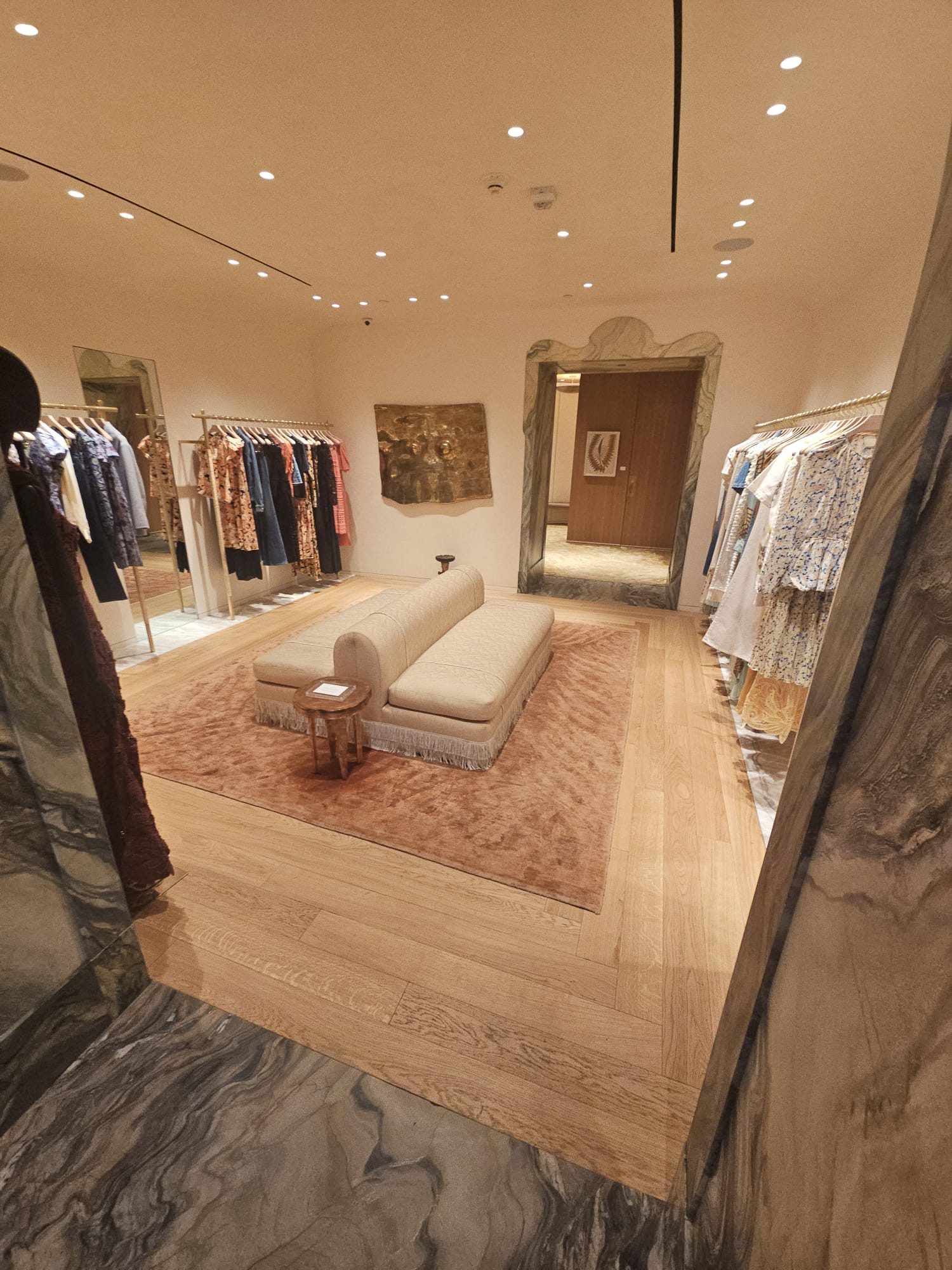 Custom pattern engineered oak floor around the seating area of the Ulla Johnson boutique on Madison Avenue