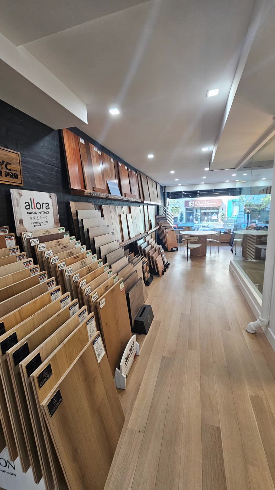 NYC Floor Pro showroom aisle with full-size engineered wood samples