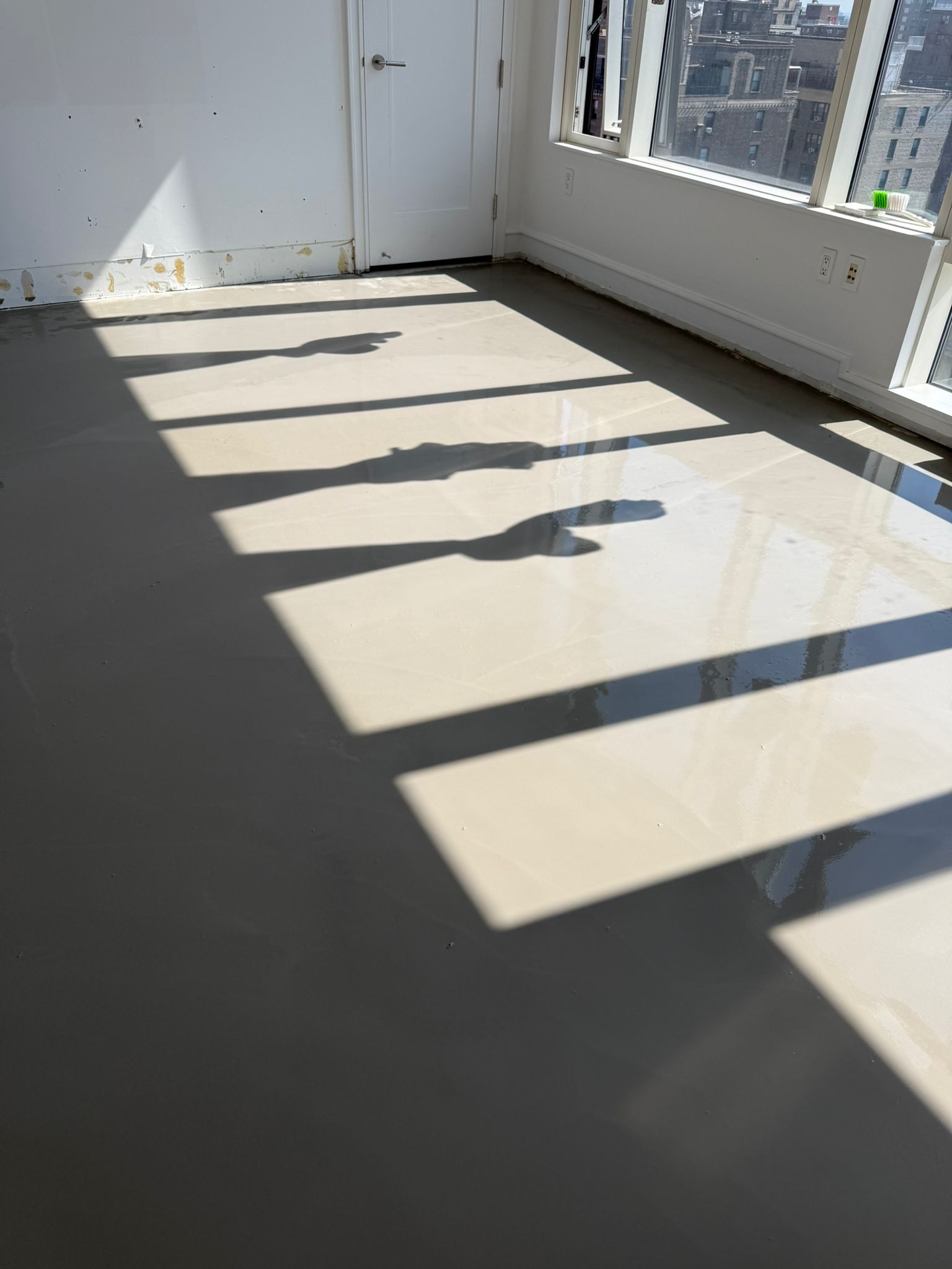 Self-leveling cement poured over the slab in a SoHo apartment