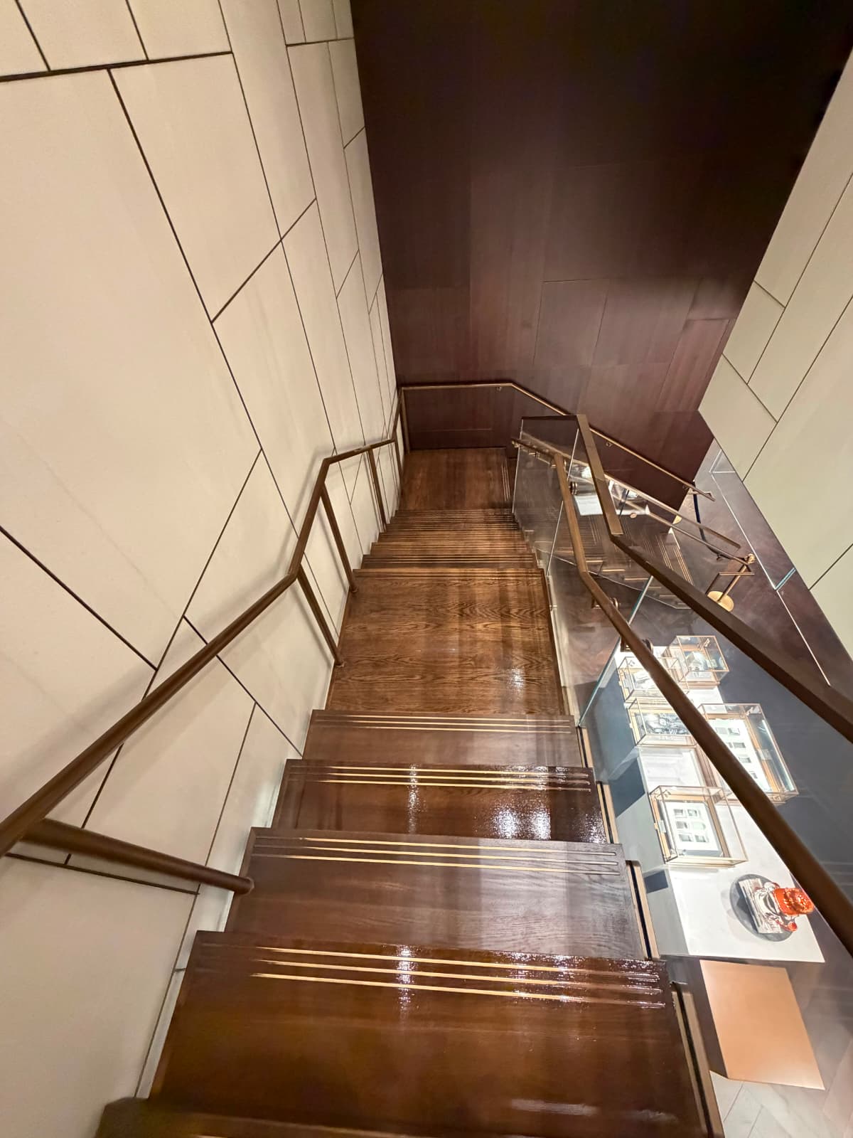 Walnut staircase with a satin finish at the Bucherer 1888 flagship on Madison Avenue