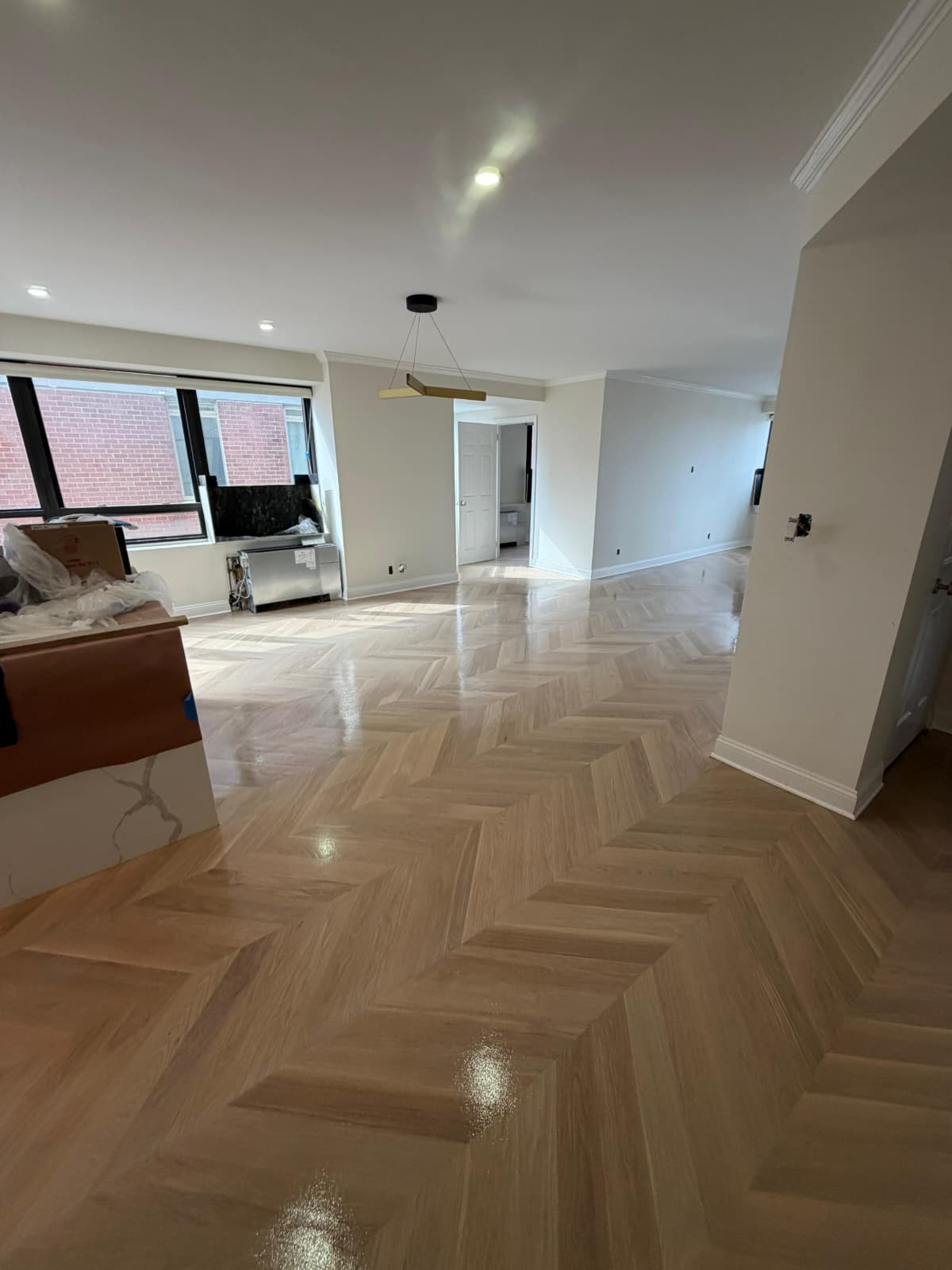 Finished white oak chevron floor in a Midtown East apartment